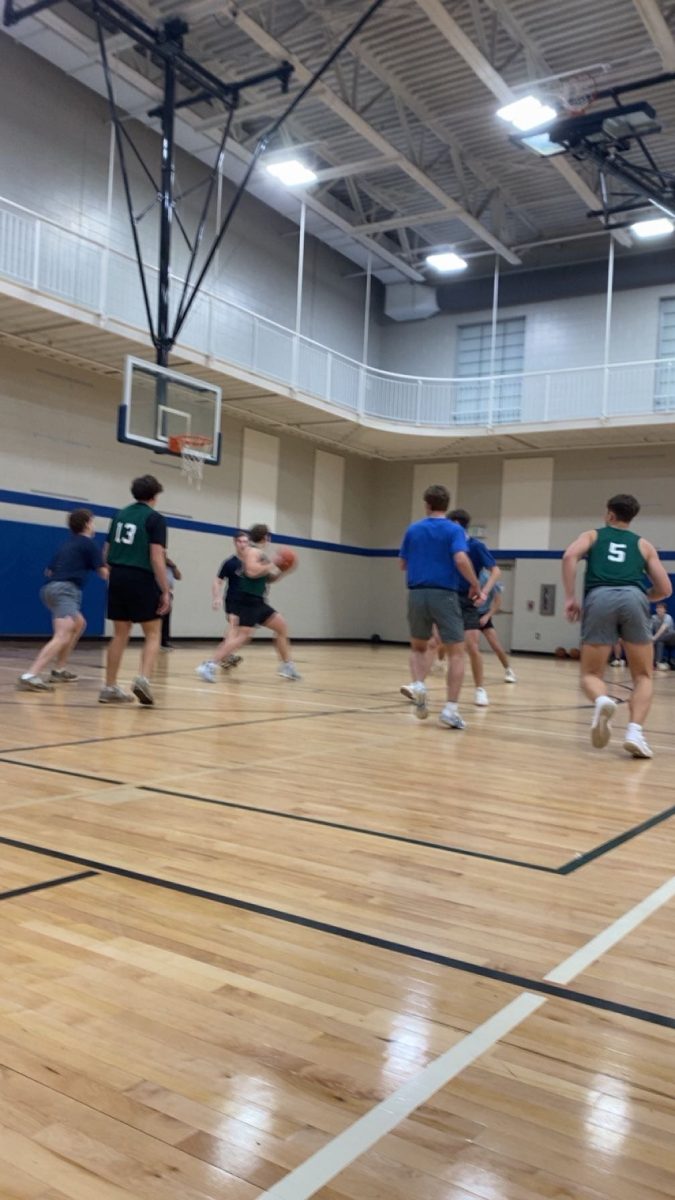 Advent and First Presbyterian players compete during a Church League game.