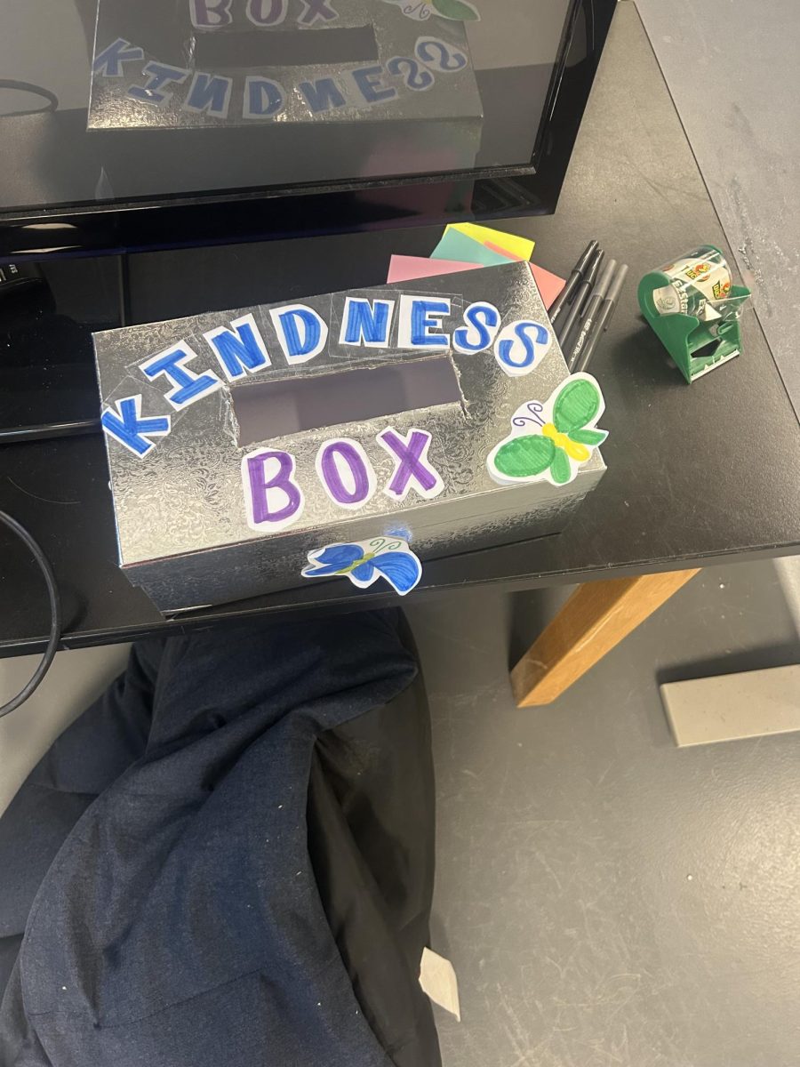 The SHS girls lacrosse team practices kindness by writing compliments for each other and dropping them into the box.