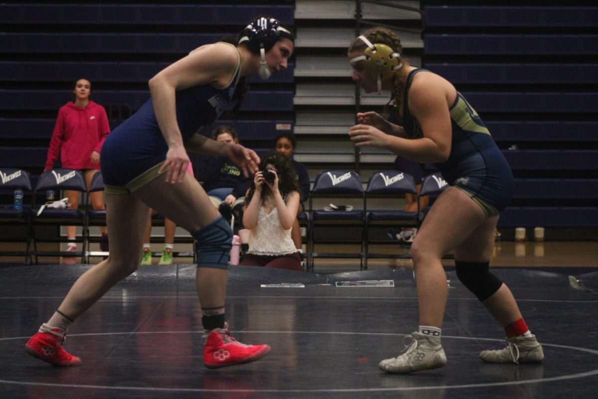 Eva Clair Davis (9) faces off her opponent for her next wrestling match.