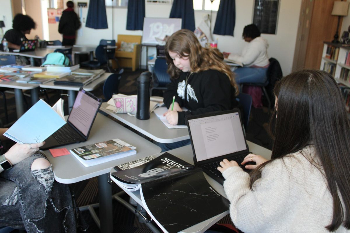Students work together to make final touches on the latest issue of the First Circle magazine.