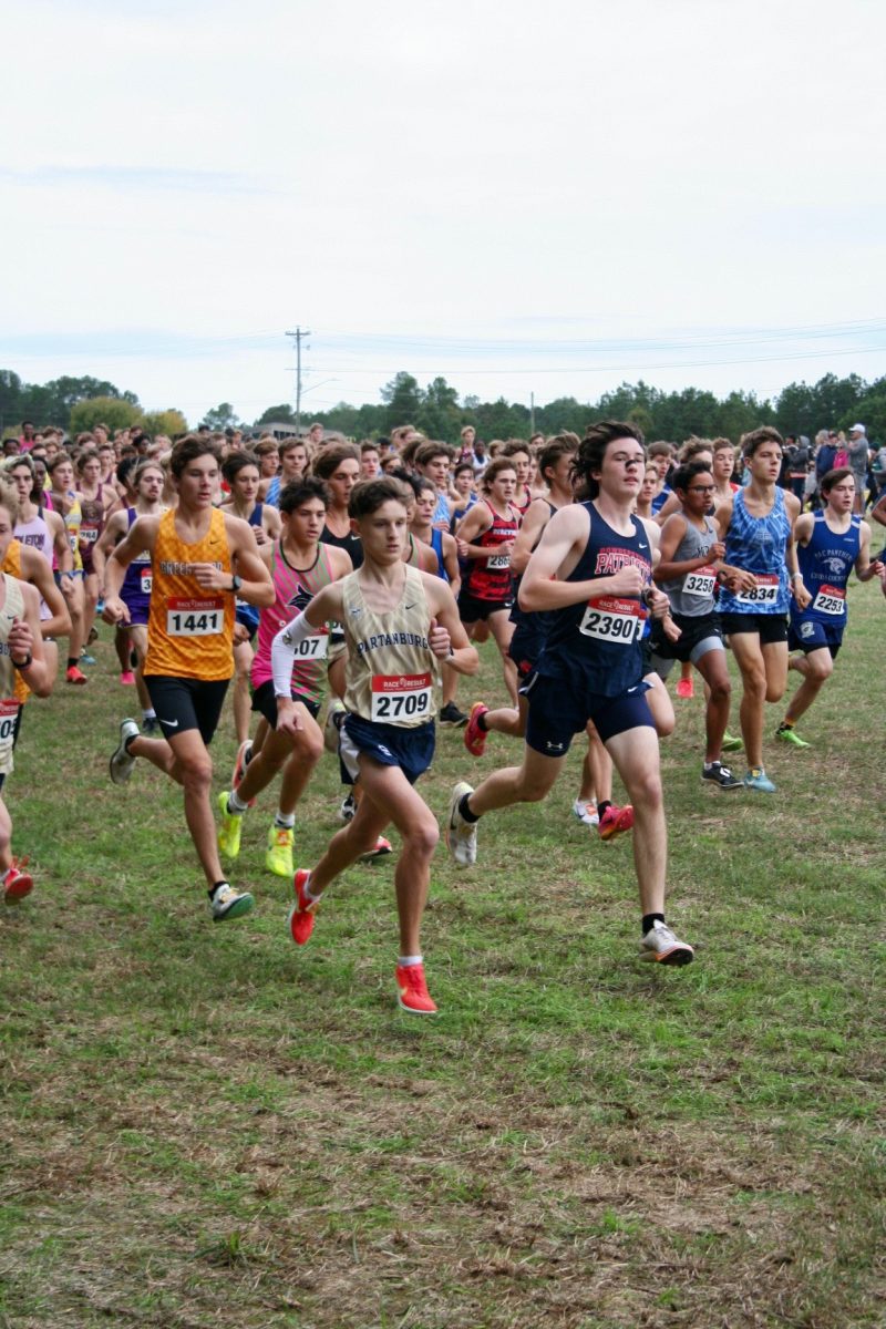 Chap Willbanks (12), a runner for Spartanburg High School, starts his Cross Country meet off strong. 