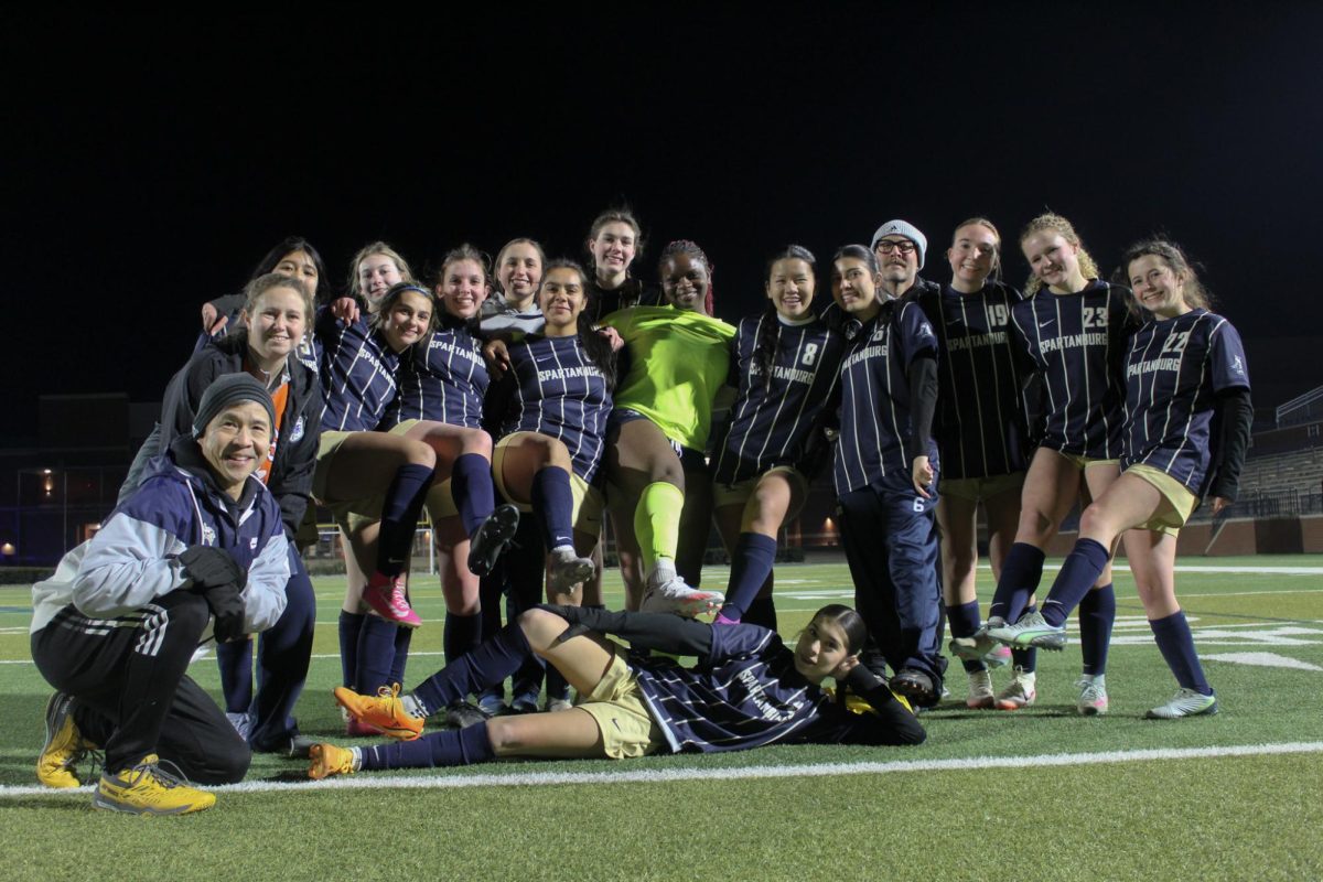 The Varsity Girls' soccer team poses for a post-game picture after defeating the Woodruff Wolverines. 