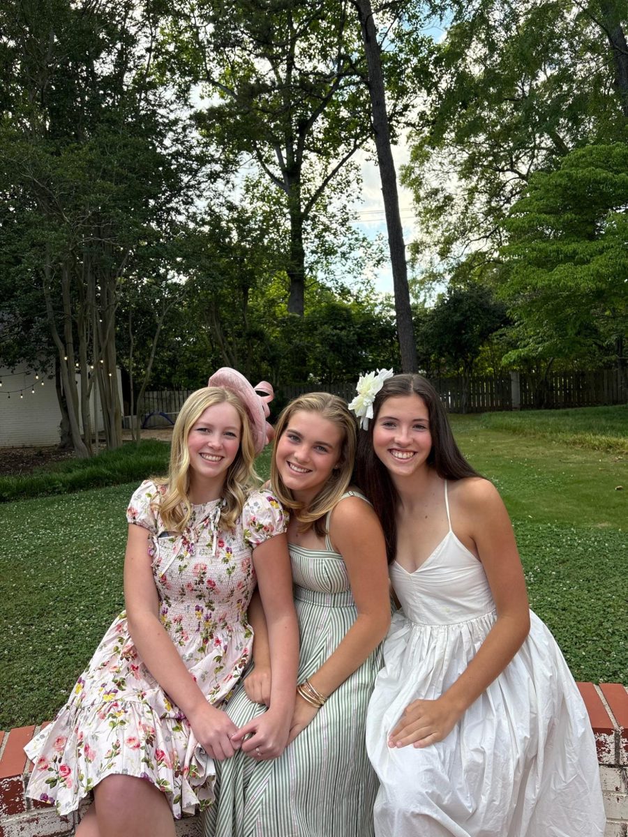 Jane Close (10), Wallace Lynch (10) and Jane Colbath (10) gather together to watch the Kentucky Derby.