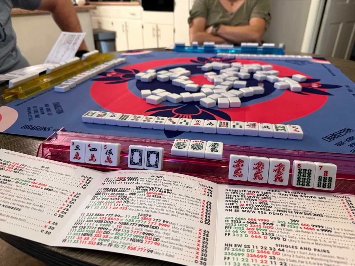 A game of Mahjong in action, with the variety of tiles displayed showing their intricate details.