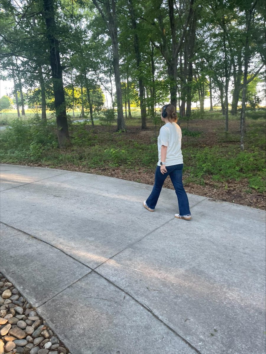 SHS student listens to a podcast while they go on a walk.